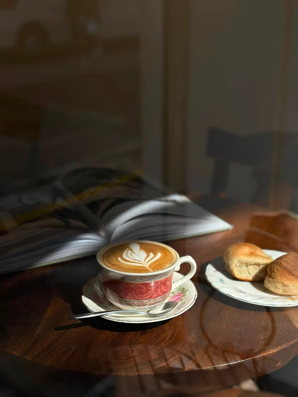 Latte and bread served on a table at Sta. Cruz Coffee Spot